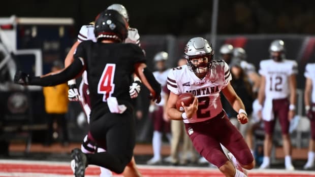 Oct 2, 2021; Cheney, WA, USA; Montana Grizzlies quarterback Camron Humphrey (2) runs the ball against Eastern Washington Eagles defensive back Calin Criner (4) in the first half at Roos Field. Mandatory Credit: James Snook-USA TODAY Sports
